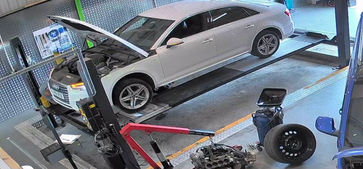 A white saloon on the MOT test bay